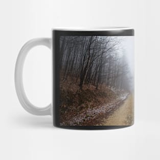 Foggy road in the forest Mug